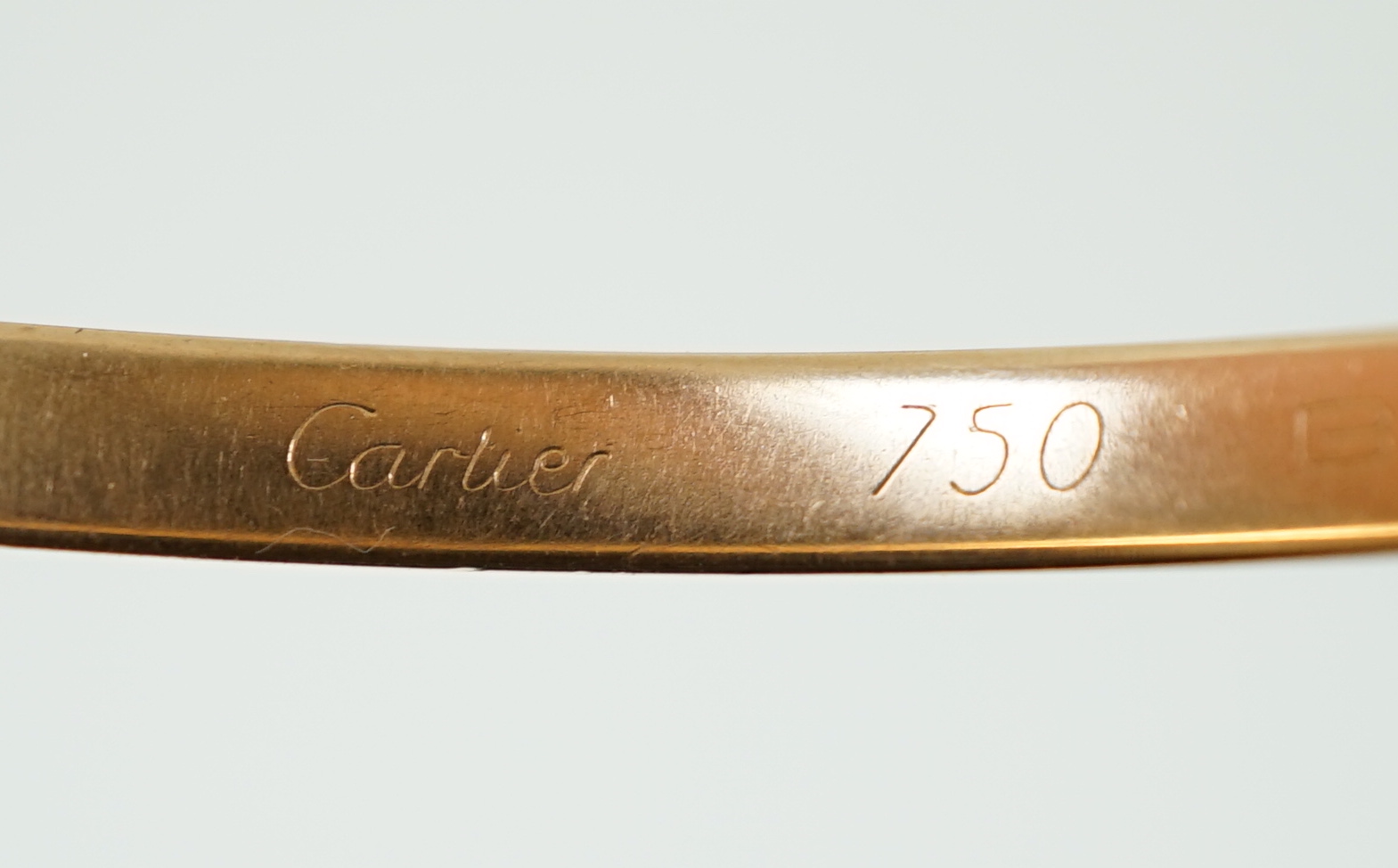 A modern three colour 18ct gold Cartier Russian triple bangle